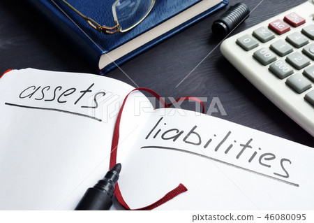 List of assets vs liabilities in the note pad. List of assets vs liabilities in the note pad. 46080095