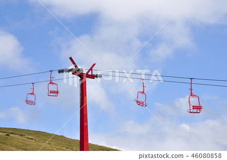 Red ski chairlifts in summer mountains 46080858