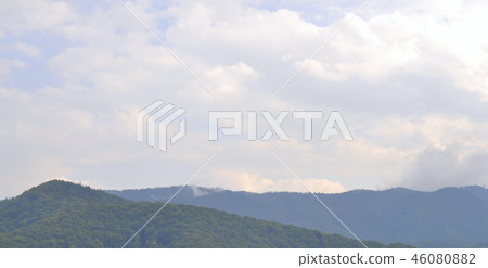 Mountain peaks in clouds. Natural background 46080882