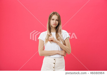 Shot of bored annoyed beautiful teenage girl with straight blond hair looking at camera with boring Shot of bored annoyed beautiful teenage girl with straight blond hair looking at camera with boring 46080964