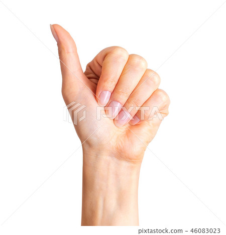 Woman holding hand in gesture of like sign, giving thumb up 46083023