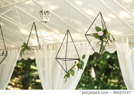 Decorative hanging cages with fresh flowers. decor Decorative hanging cages with fresh flowers. decor 46083597