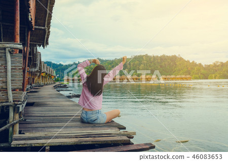 Young woman sitting and streching exercise 46083653