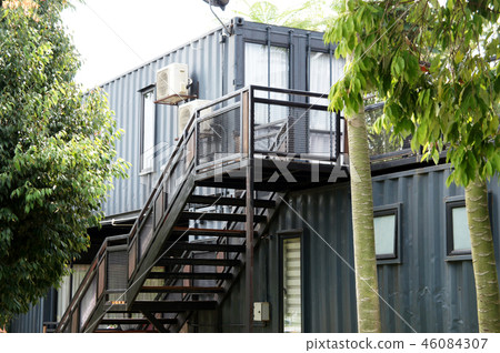 Building made from refurbished shipping containers 46084307