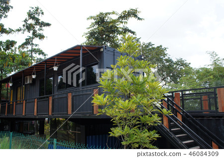 Building made from refurbished shipping containers 46084309