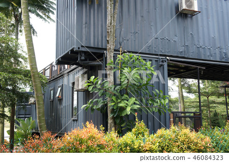 Building made from refurbished shipping containers 46084323