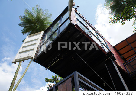 Building made from refurbished shipping containers 46084338