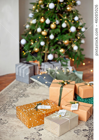 Christmas composition. Christmas gifts, fir tree branches, knitted blanket on white wooden 46085026