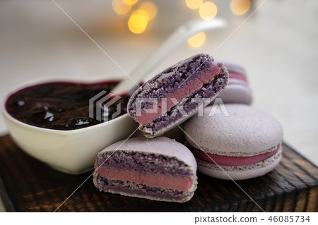 macaroons with currants on a white plate with jam 46085734