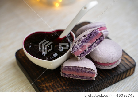 macaroons with currants on a white plate with jam macaroons with currants on a white plate with jam 46085743
