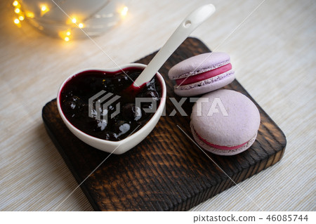 macaroons with currants on a white plate with jam macaroons with currants on a white plate with jam 46085744
