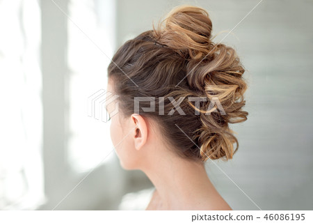 Hair Styling Rear View, Brown color Iroquois hair style on background. Hair Styling Rear View, Brown color Iroquois hair style on background. 46086195
