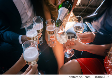 Party people celebrating with champagne Party people celebrating with champagne 46086196