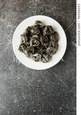 Squid ink tortellini pasta. Squid ink tortellini pasta. 46088893