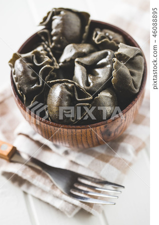 Squid ink tortellini pasta. Squid ink tortellini pasta. 46088895
