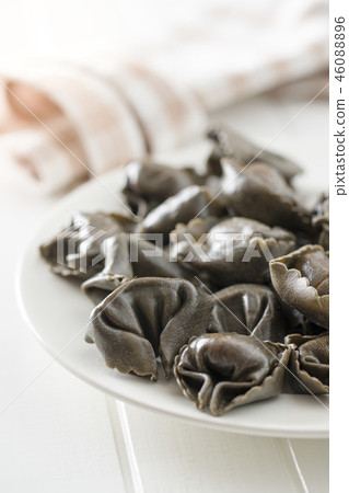 Squid ink tortellini pasta. Squid ink tortellini pasta. 46088896