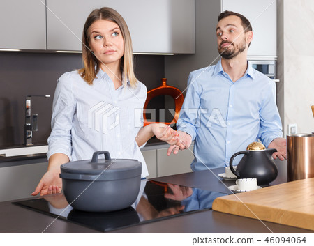 Family squabbling in kitchen Family squabbling in kitchen 46094064