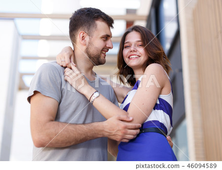 Happy man and girl standing and hugging Happy man and girl standing and hugging 46094589