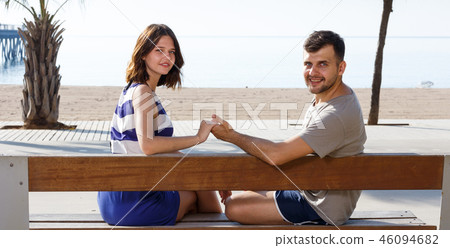 Man and girl resting and hugging. Back view Man and girl resting and hugging. Back view 46094682