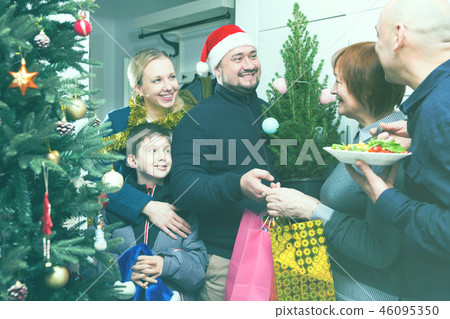 Family gathering for Christmas eve at mother home 46095350
