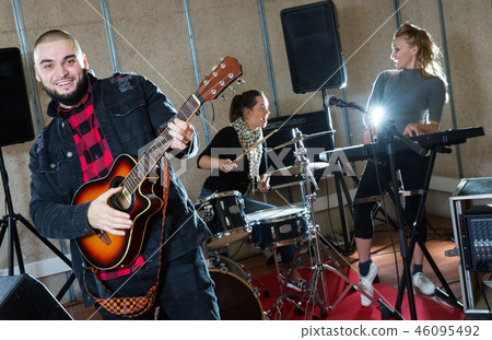 Emotional guy with guitar rehearsing 46095492