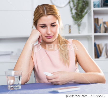 Young female is thoughtful and bored sitting alone 46095512