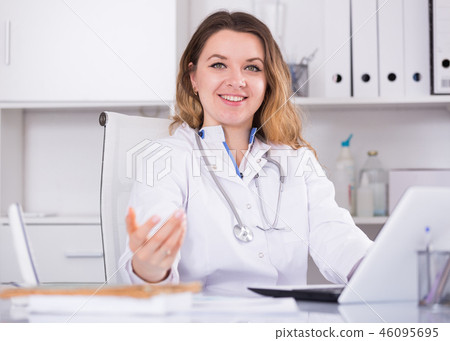 Smiling female medical working Smiling female medical working 46095695