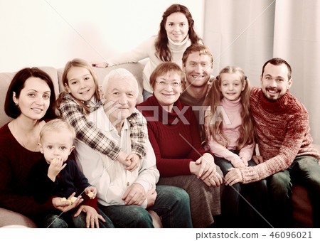 Happy family making numerous photos 46096021