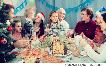 Family members making conversation during dinner 46096075