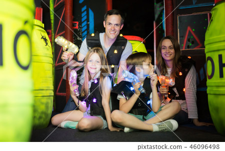 Kids and parents with laser guns 46096498