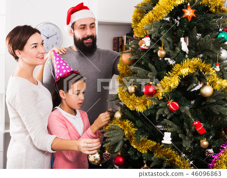 Family members preparing for Christmas Family members preparing for Christmas 46096863