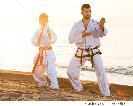 Man and boy practising karate 46096864