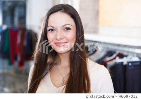 Young woman customer standing in the fashion shop Young woman customer standing in the fashion shop 46097012