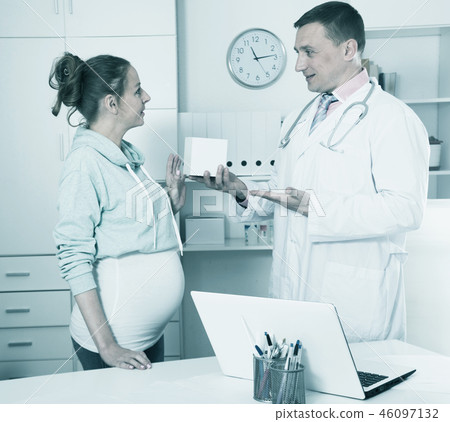 Doctor and pregnant visitor Doctor and pregnant visitor 46097132