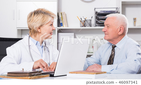 Female doctor with male client Female doctor with male client 46097341