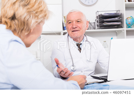 Male doctor with female client 46097451