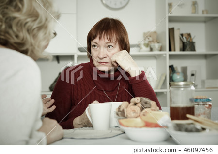 Old women in the kitchen quarrel Old women in the kitchen quarrel 46097456