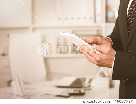 Man using touchscreen phone 46097787