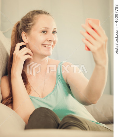 Woman using phone Woman using phone 46097788