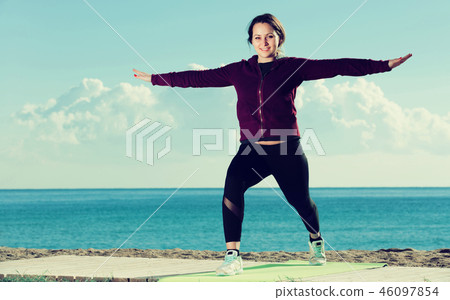 Happy young woman training 46097854