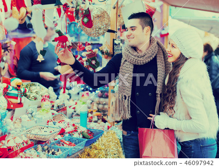 Young man with girlfriend at X-mas market 46097942