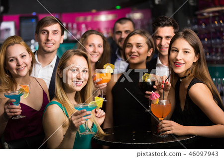 Laughing colleagues dancing on corporate party Laughing colleagues dancing on corporate party 46097943