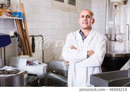 Portrait of mature man working in modern food factory Portrait of mature man working in modern food factory 46098219