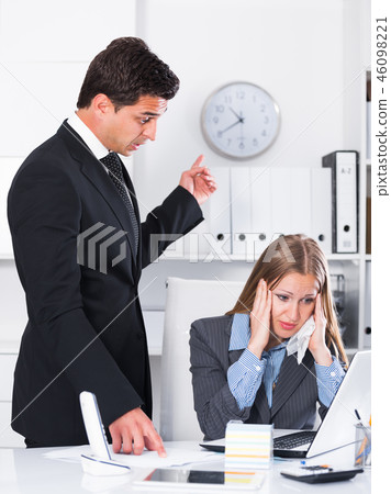 Angry boss blowing up subordinate Angry boss blowing up subordinate 46098221