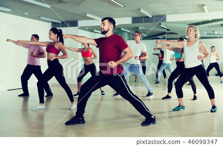 Group of active people practicing together 46098347