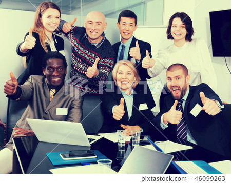 international team emotionally gesturing and celebrating 46099263