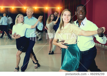 People dancing samba in pairs People dancing samba in pairs 46099299