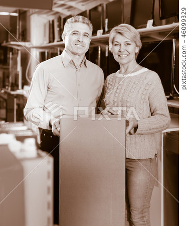 Mature couple are happy with choice and purchased consumer electronics 46099329