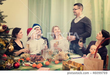 Funny and big family celebrates Christmas 46099789