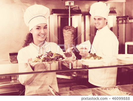 Staff posing at kebab counter 46099888